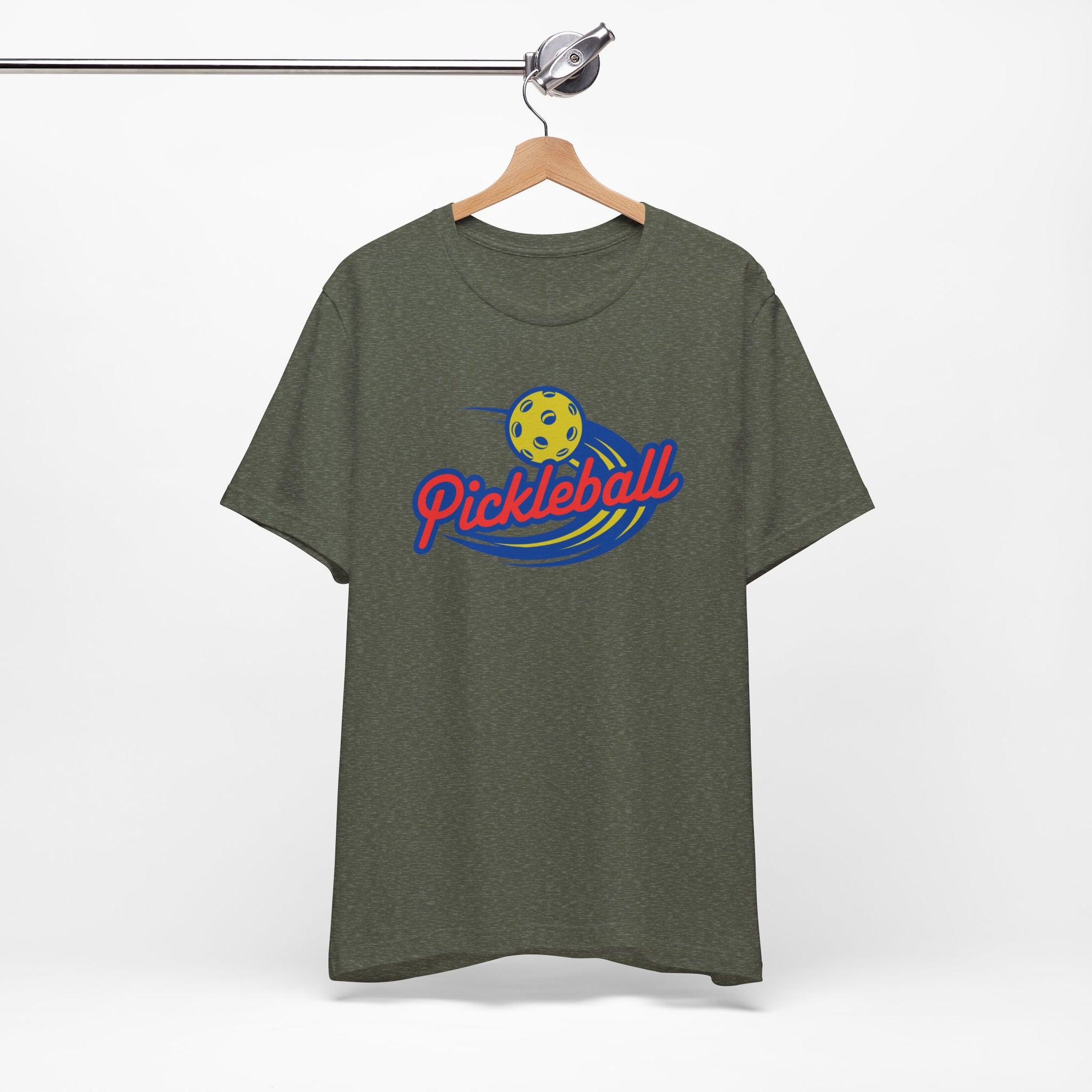 Military green t-shirt with a classic pickleball logo featuring the word pickleball and a yellow pickleball with motion lines, on a hanger against a white background