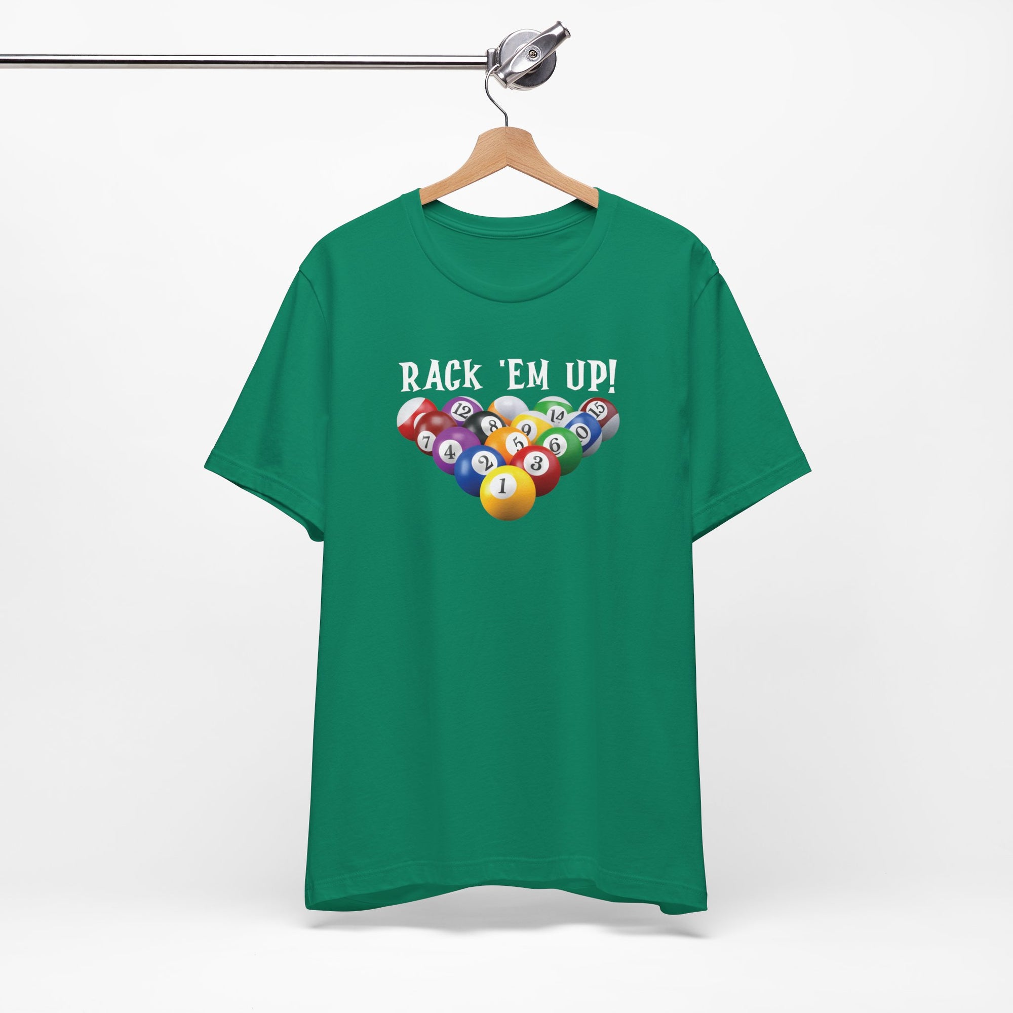 Green t-shirt with racked pool ball design and 'Rack 'Em Up!' text, on a hanger against a white background