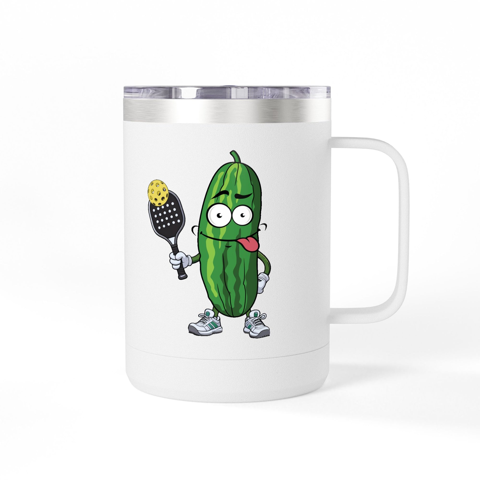 A white travel coffee mug tumbler with handle and lid with a cartoon pickle with googly eyes and his tongue sticking out, holding a pickleball paddle with a yellow pickleball, against a white background