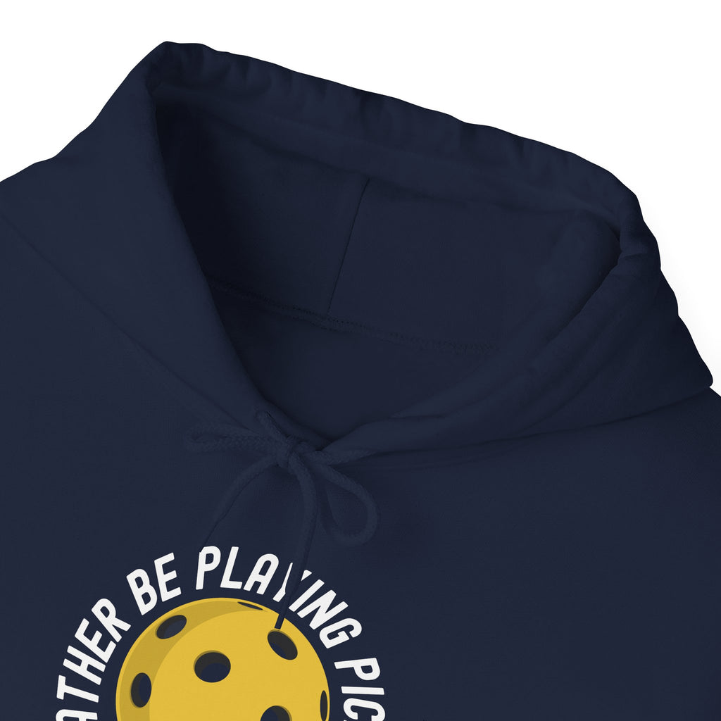 Neckline of a hoodie with graphic of a yellow pickleball and white paddle with the text "I'd Rather Be Playing Pickleball" on a white background