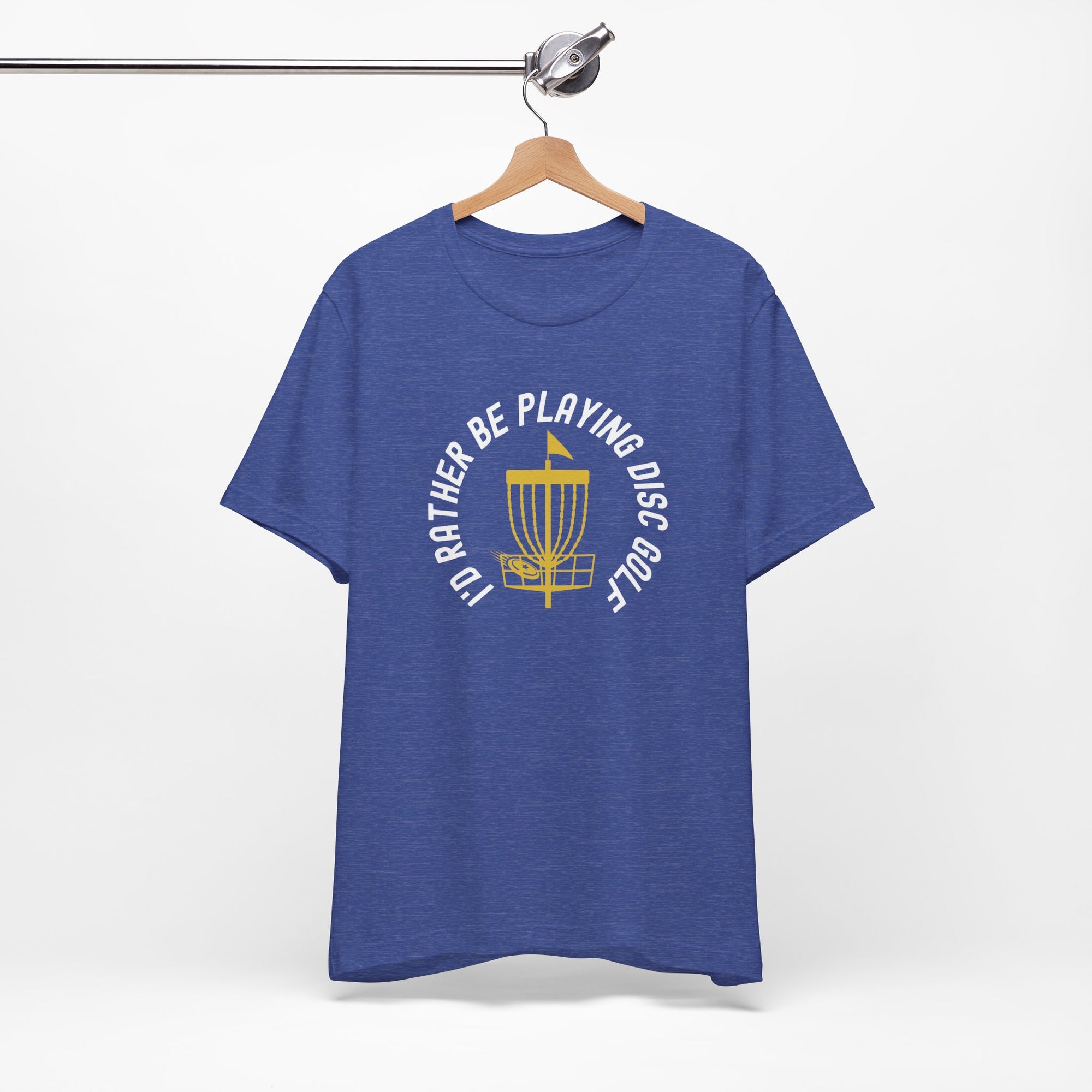 Blue t-shirt with a graphic of disc golf chains, basket, and disc and text that says "I'd Rather Be Playing Disc Golf" on a hanger against a white background
