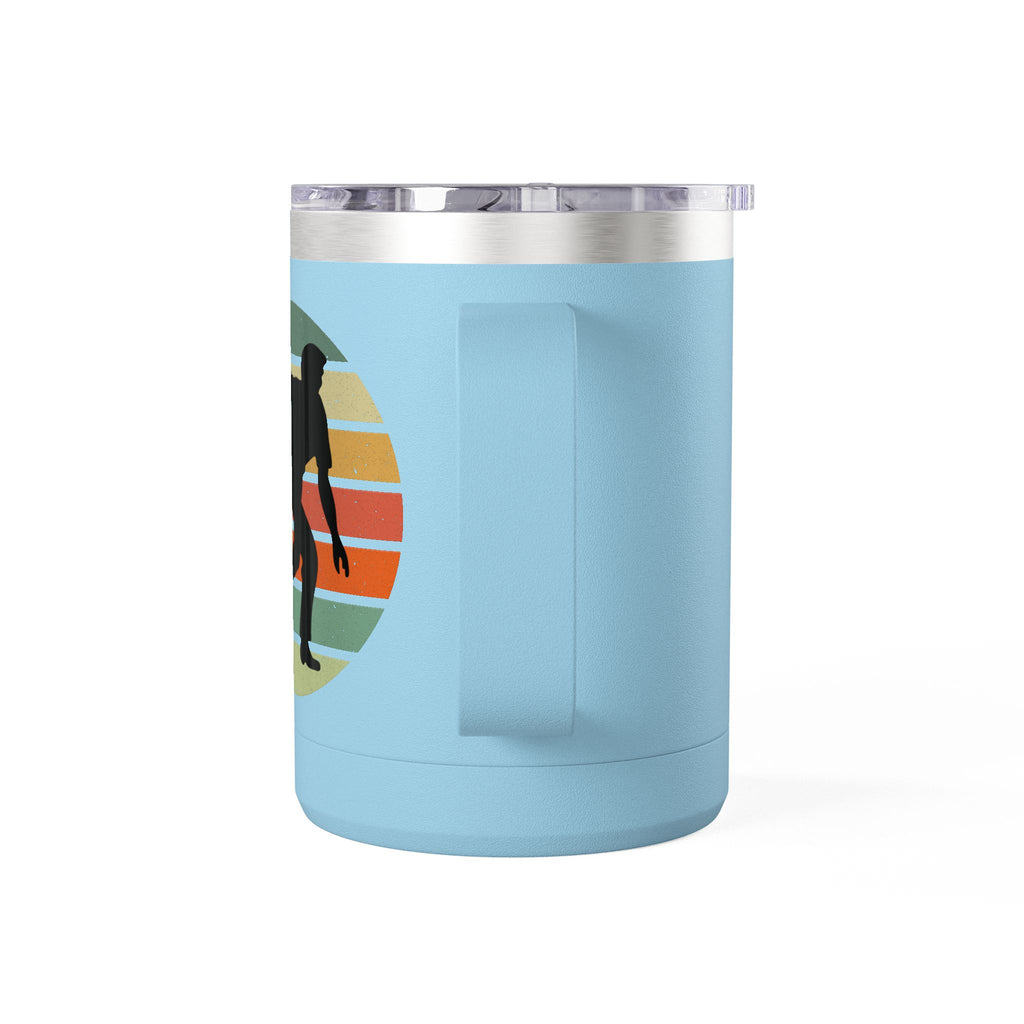 Back view of a teal travel coffee mug with lid and handle with a silhouette of a person bowling and a colorful retro design on a white background.