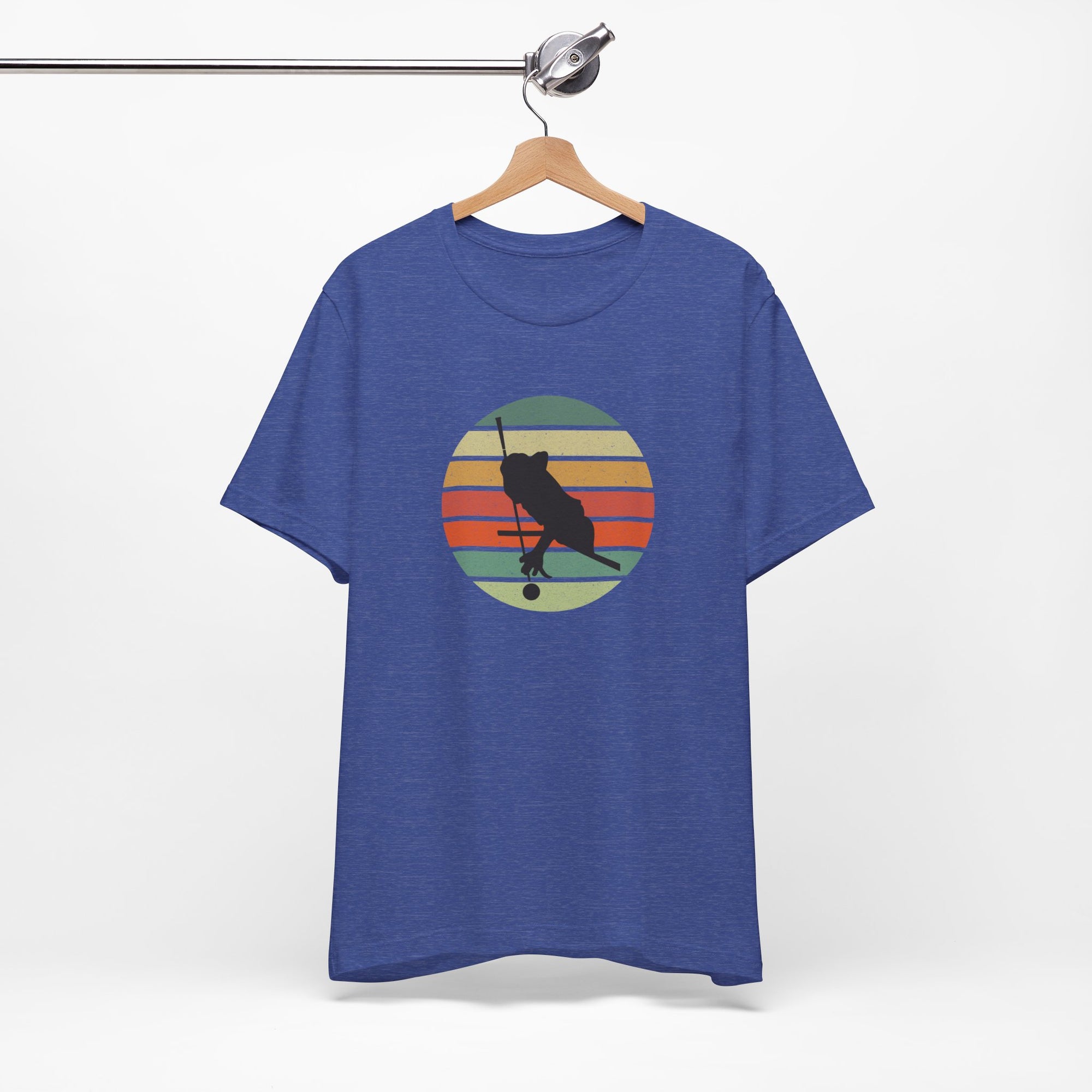 Blue t-shirt with a graphic of a billiards player silhouette over a colorful retro image against a white background