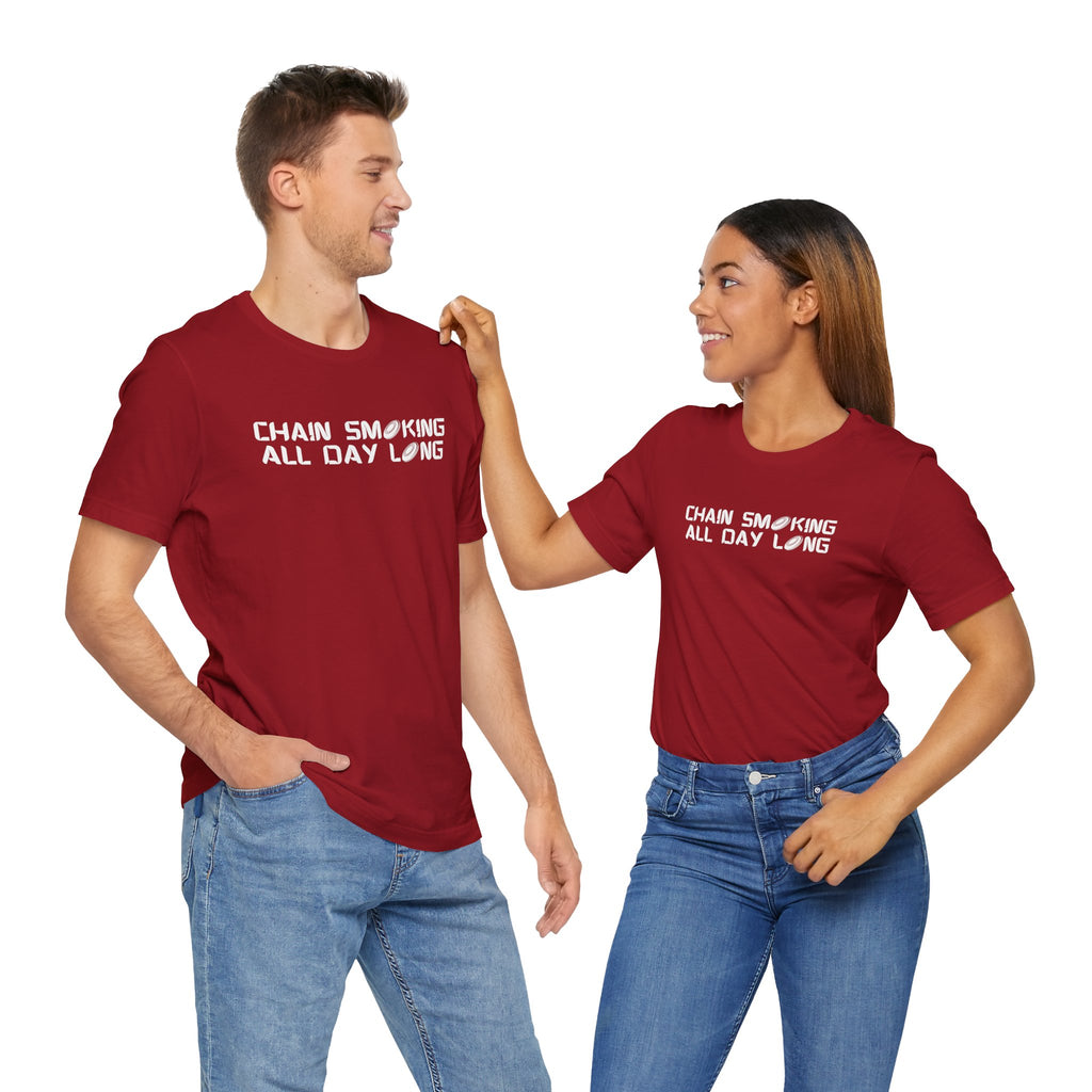 A man and a woman both wearing a red t-shirt with 'CHAIN SMOKING ALL DAY LONG' text with the O's replaced by disc golf discs, against a white background