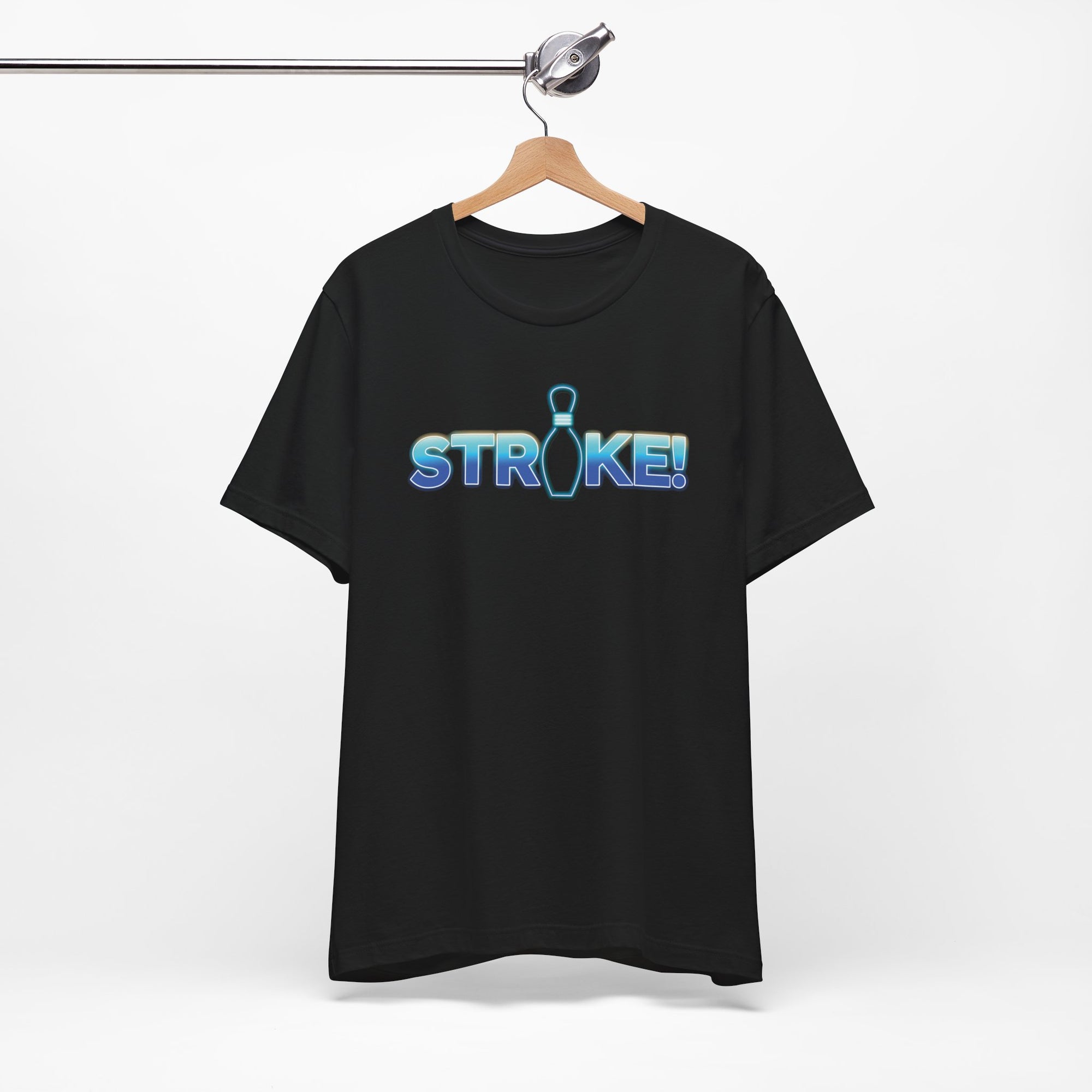 Black bowling t-shirt with 'STRIKE!' with the "I" replaced by a bowling pin, on a hanger against a white background