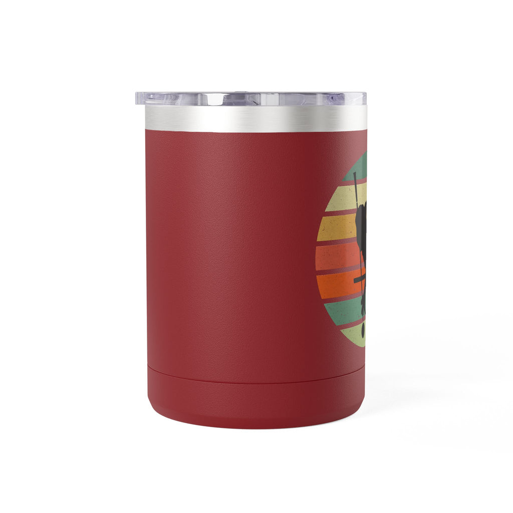 Side view of a maroon travel coffee mug with an image of a billiards player silhouette over a colorful retro graphic, on a white background