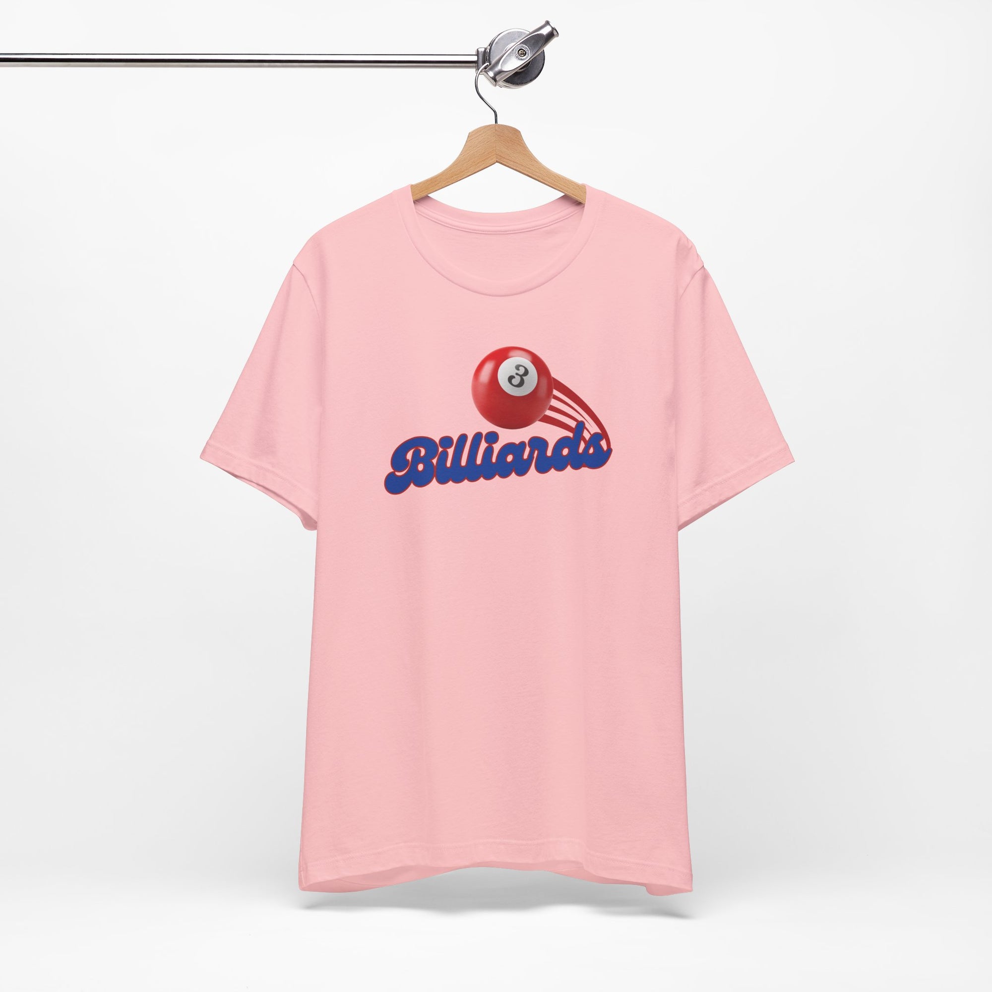 Pink t-shirt with billiards ball and text that says "Billiards" on a hanger against a white background