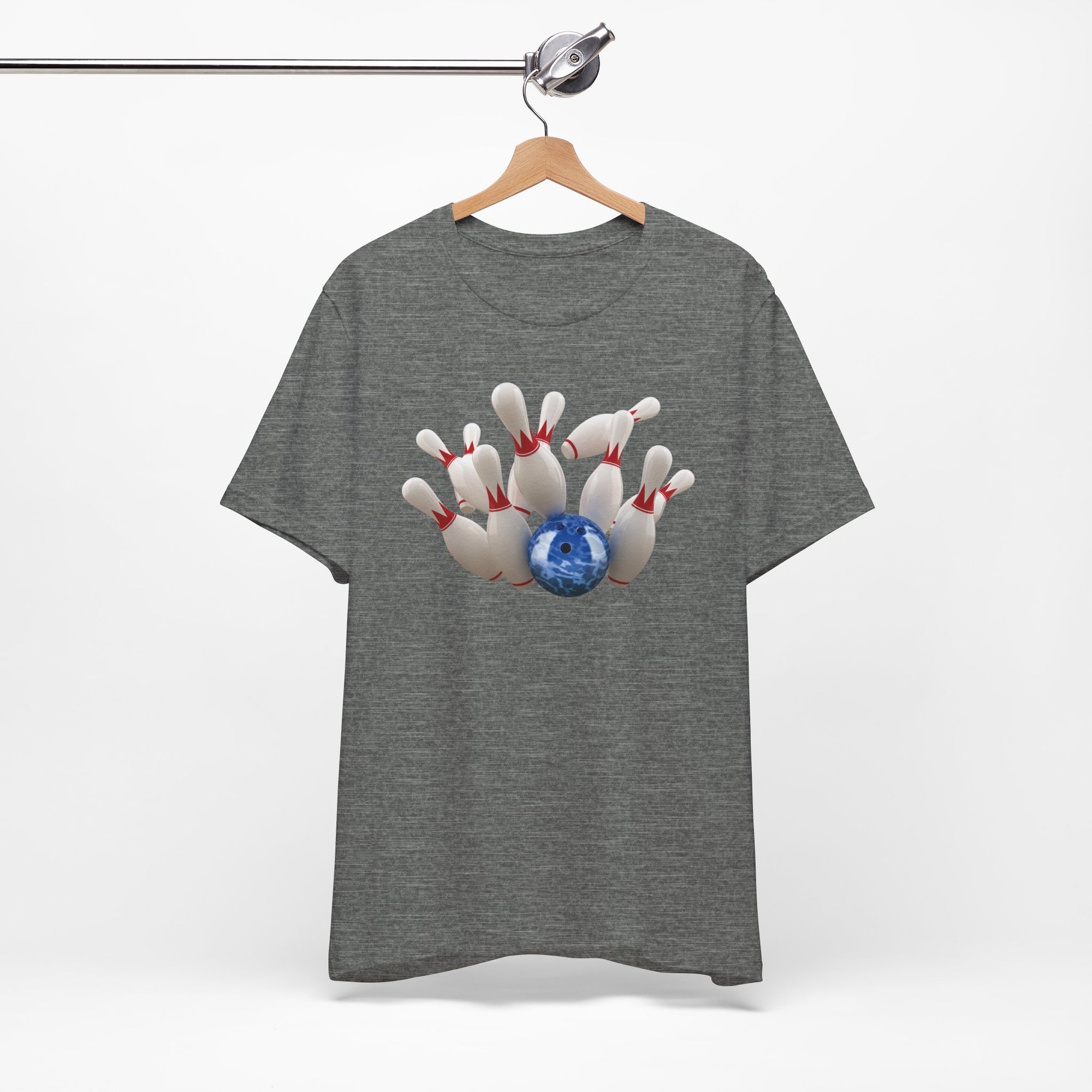 Gray t-shirt with a graphic of a blue bowling ball knocking over bowling pins, on a hanger against a white background