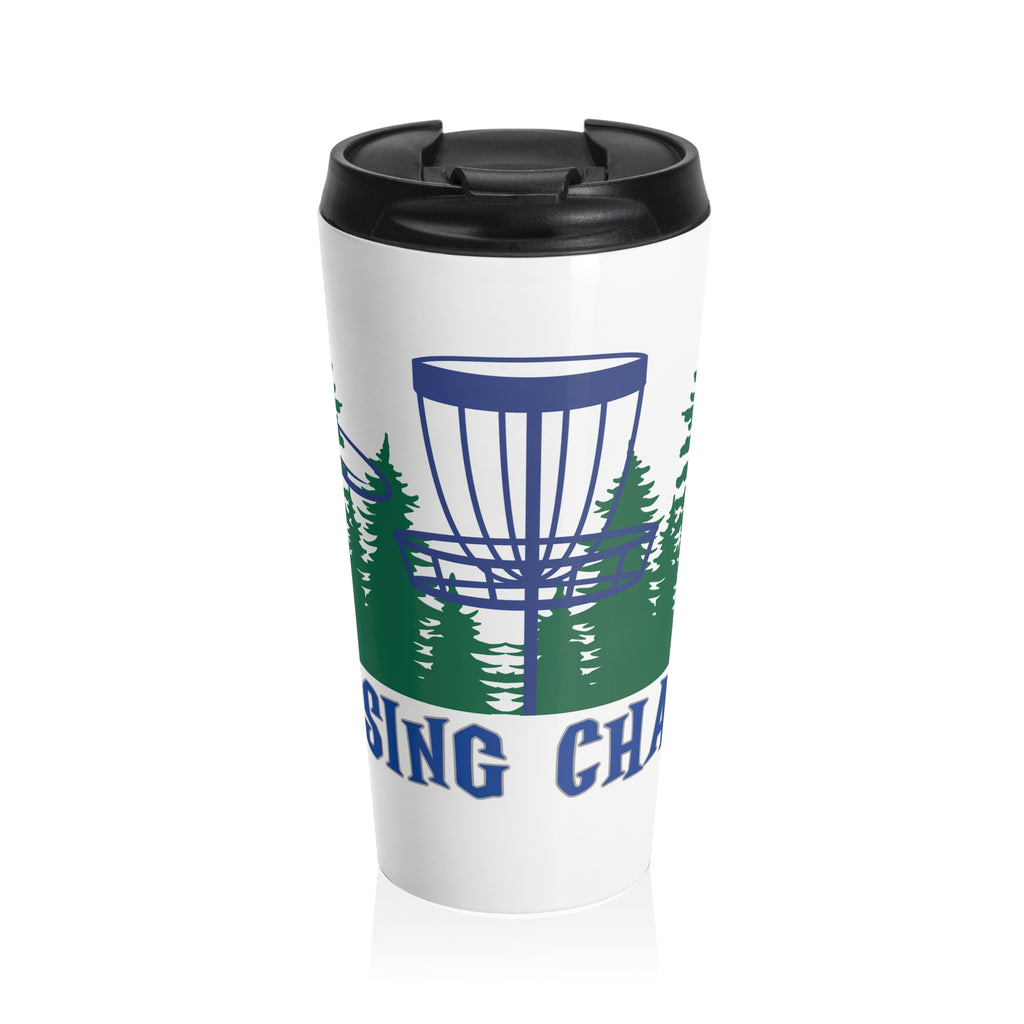 A travel tumbler mug with lid with 'Chasing Chains' graphic featuring a flying disc golf disc and basket and chains in front of a scenic evergreen tree landscape, against a white background