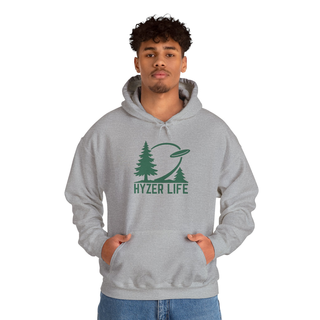Man wearing a gray hoodie with green graphic of trees and a disc golf flying with the words 'HYZER LIFE' below the image, against a white background