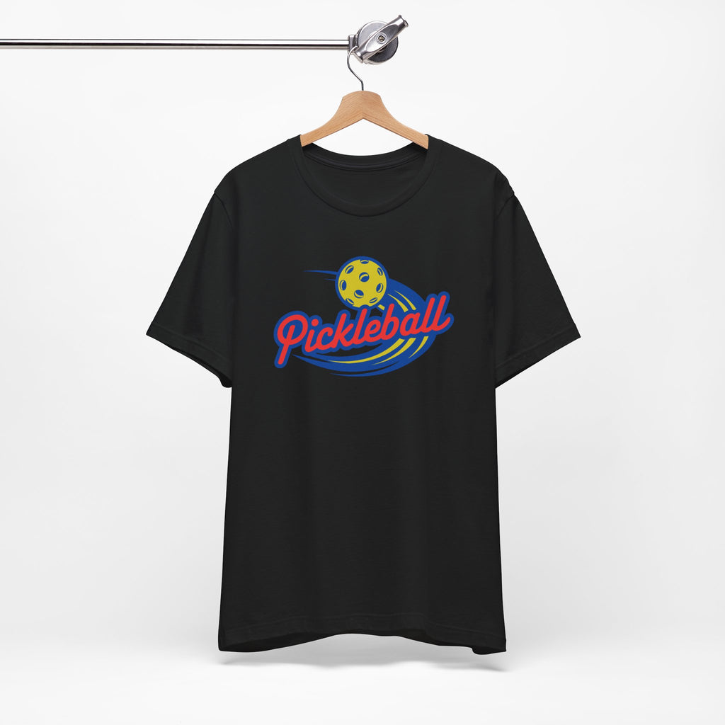 Black t-shirt with a classic pickleball logo featuring the word pickleball and a yellow pickleball with motion lines, on a hanger against a white background