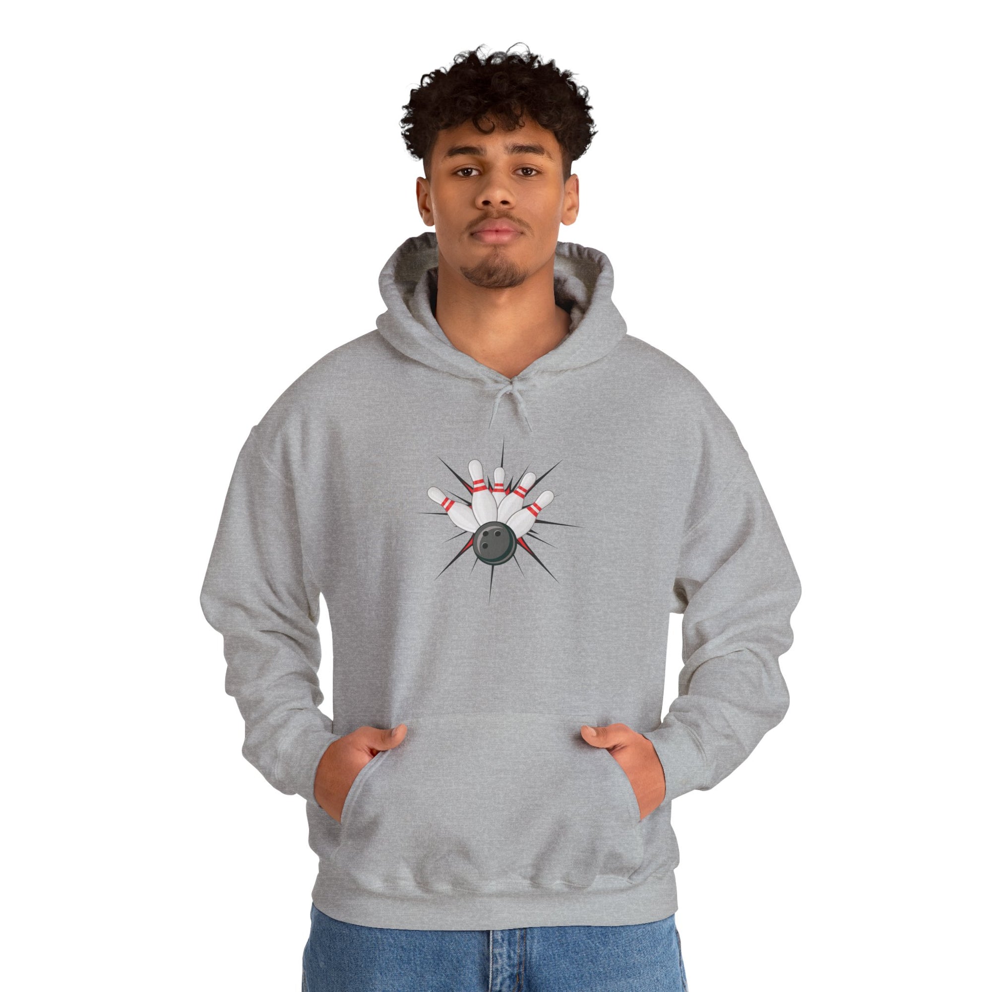 A man wearing a gray hoodie with a graphic design of a bowling ball smashing into pins on a white background