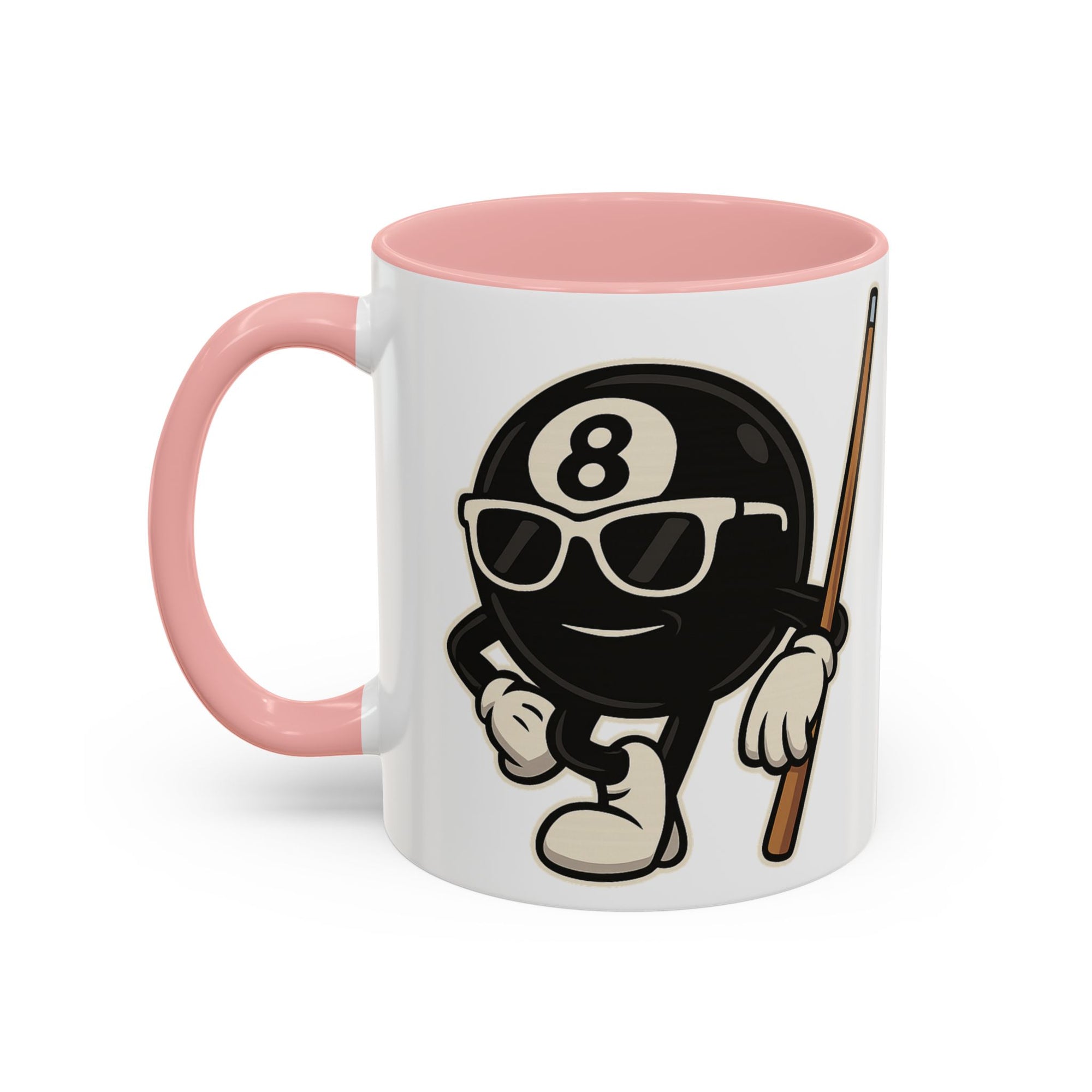 A white ceramic coffee mug with pink accents on the handle and interior, with a graphic of a cartoon billiards 8 ball with arms and legs and wearing sunglasses and leaning on a cue stick, on a white background