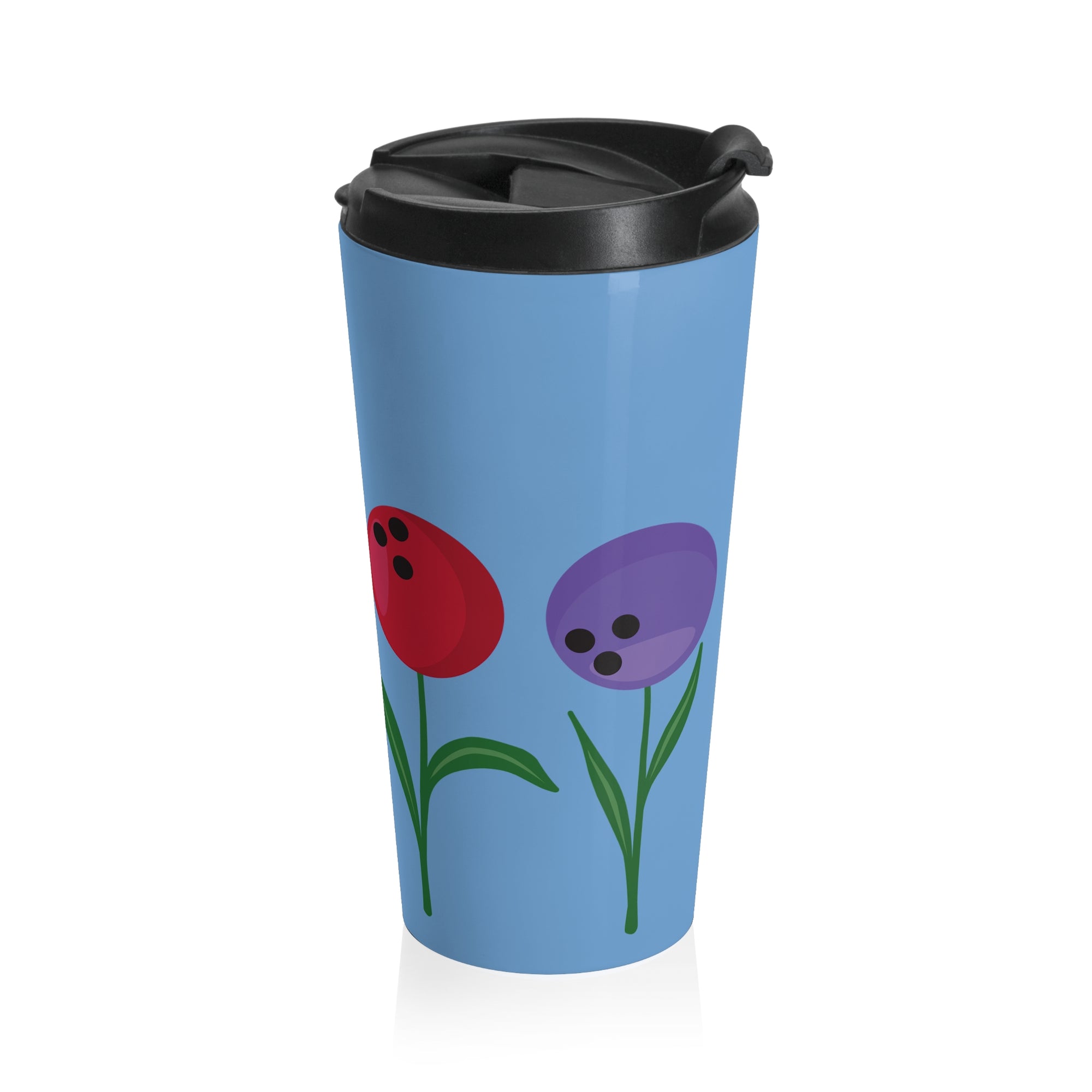 Light blue travel mug with a black lid, with colorful flowers made out of bowling balls, on a white background