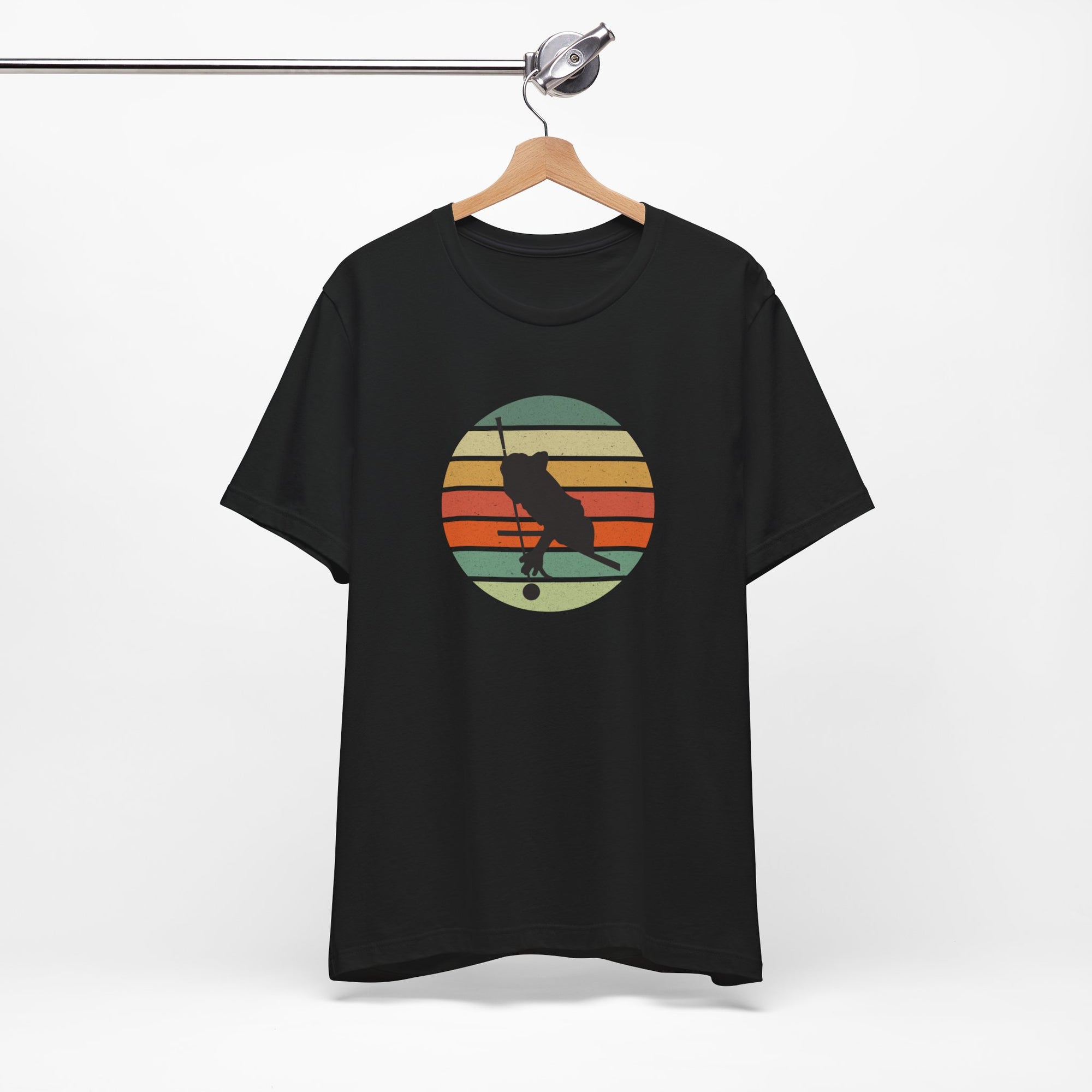 Black t-shirt with a graphic of a billiards player silhouette over a colorful retro image against a white background