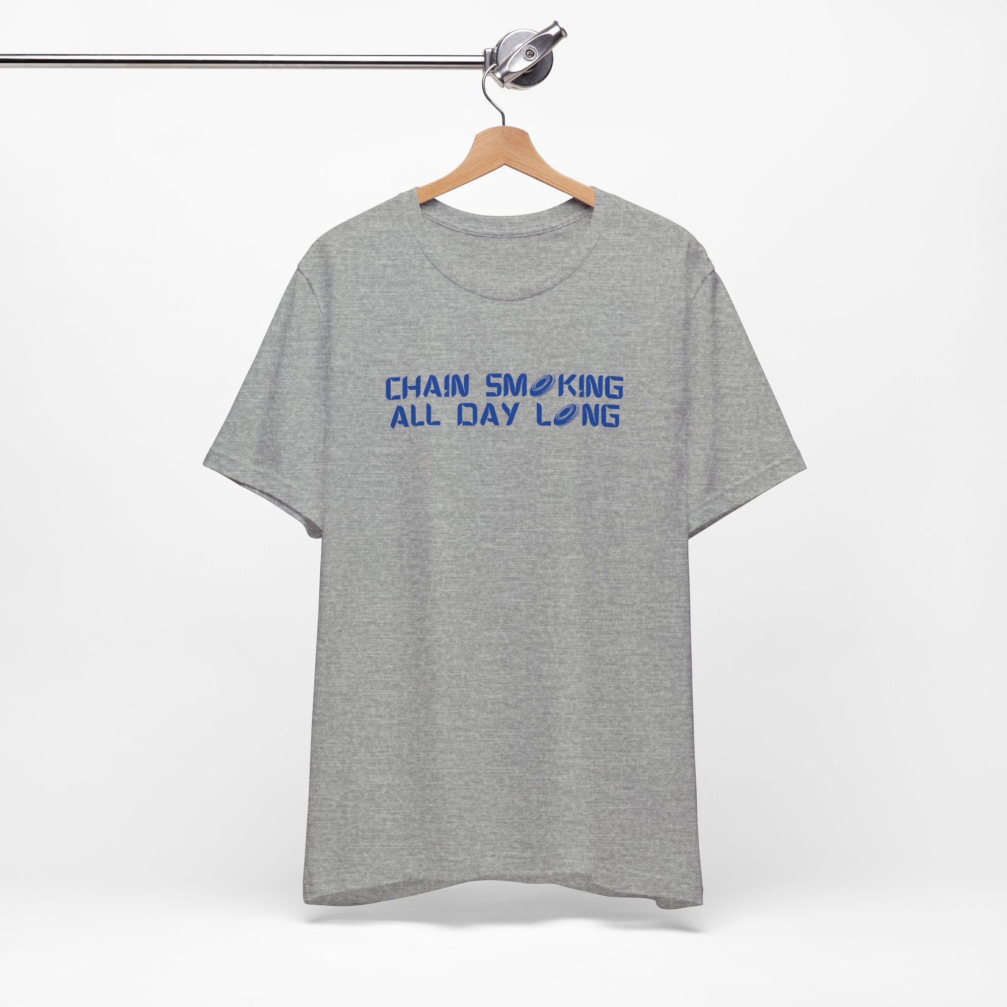 Gray t-shirt with 'CHAIN SMOKING ALL DAY LONG' text with the O's replaced by disc golf discs, on a hanger against a white background