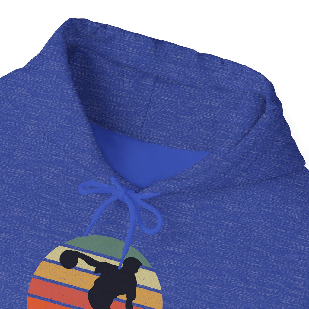 Blue hoodie with a a graphic of a silhouette of a bowler over a colorful retro image, on a white background
