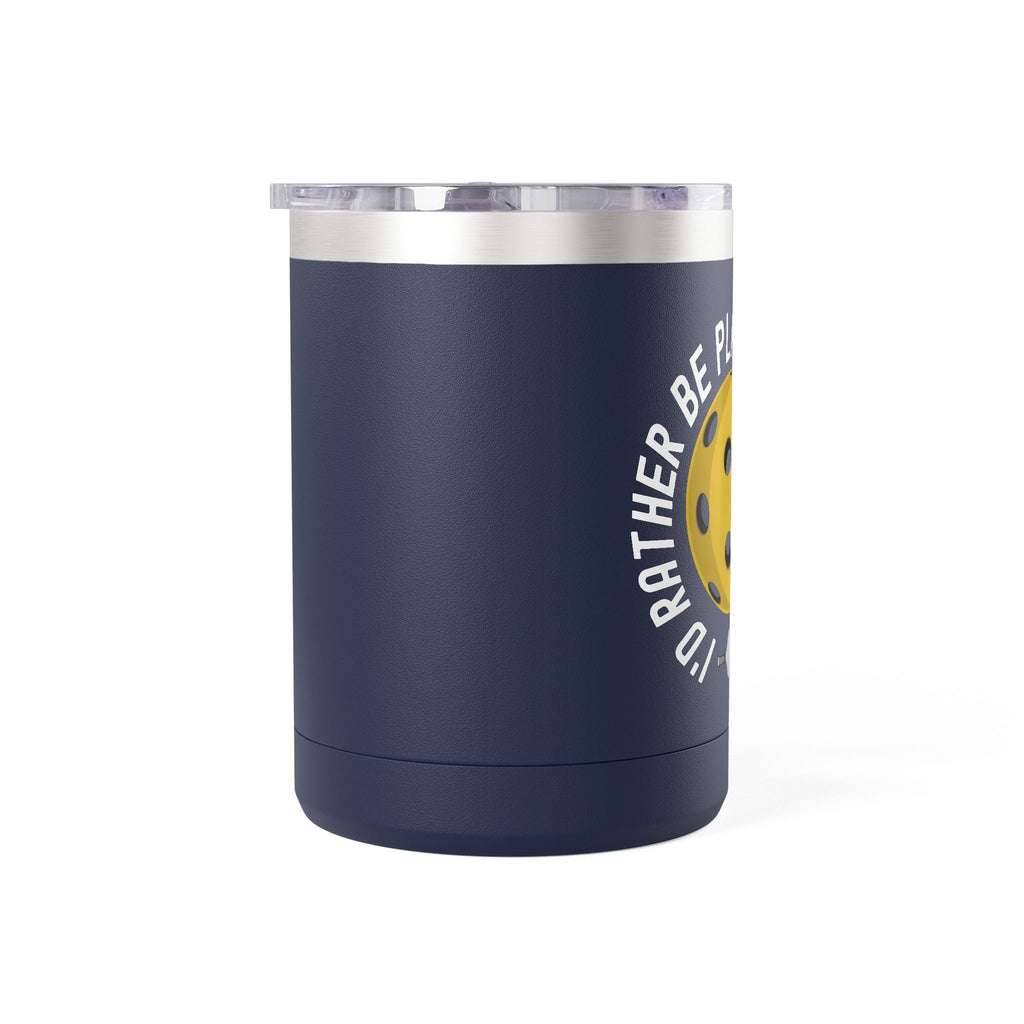 Side view of a blue travel mug with lid with a yellow pickleball graphic and the text "I'd Rather Be Playing Pickleball" on a white background