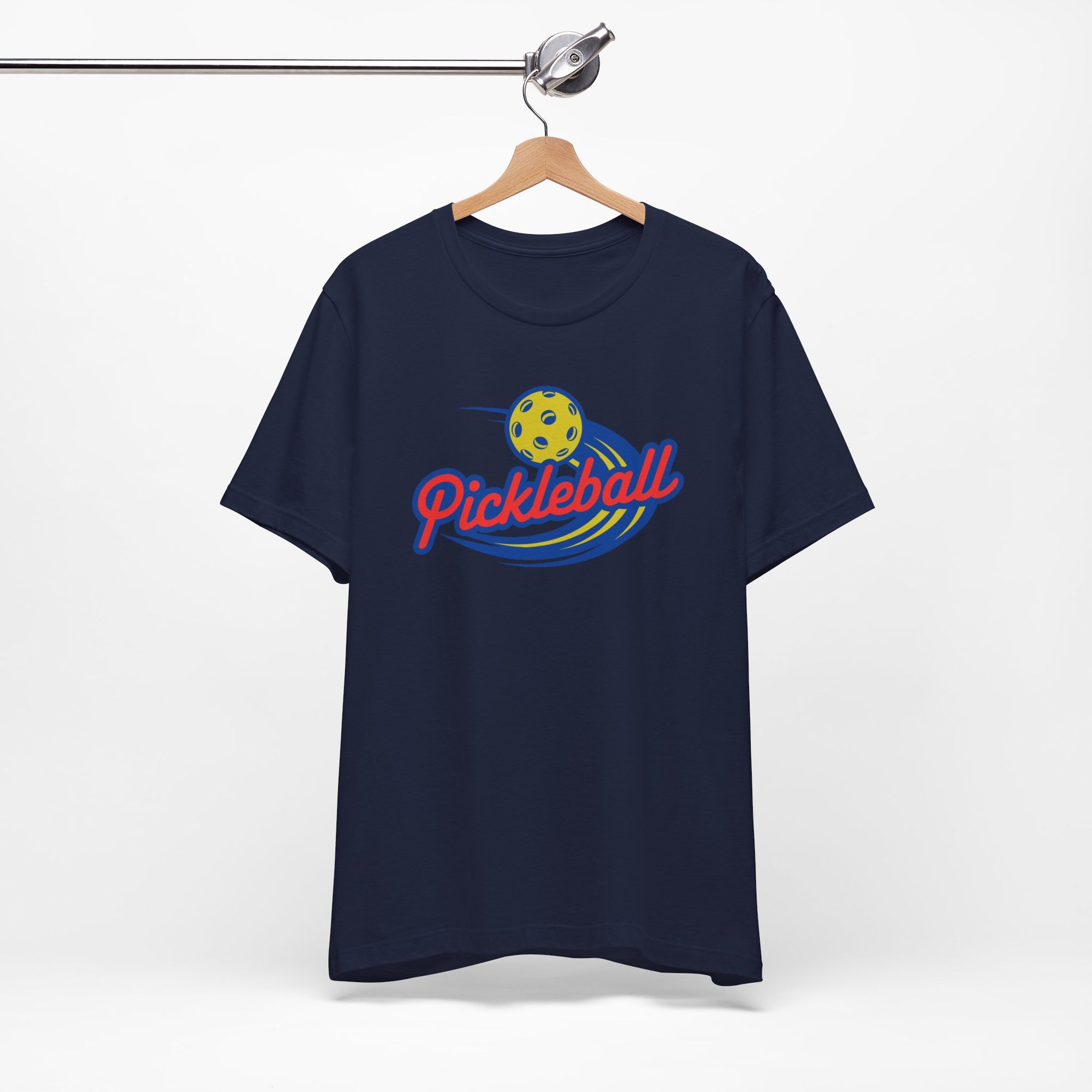 Navy blue t-shirt with a classic pickleball logo featuring the word pickleball and a yellow pickleball with motion lines, on a hanger against a white background