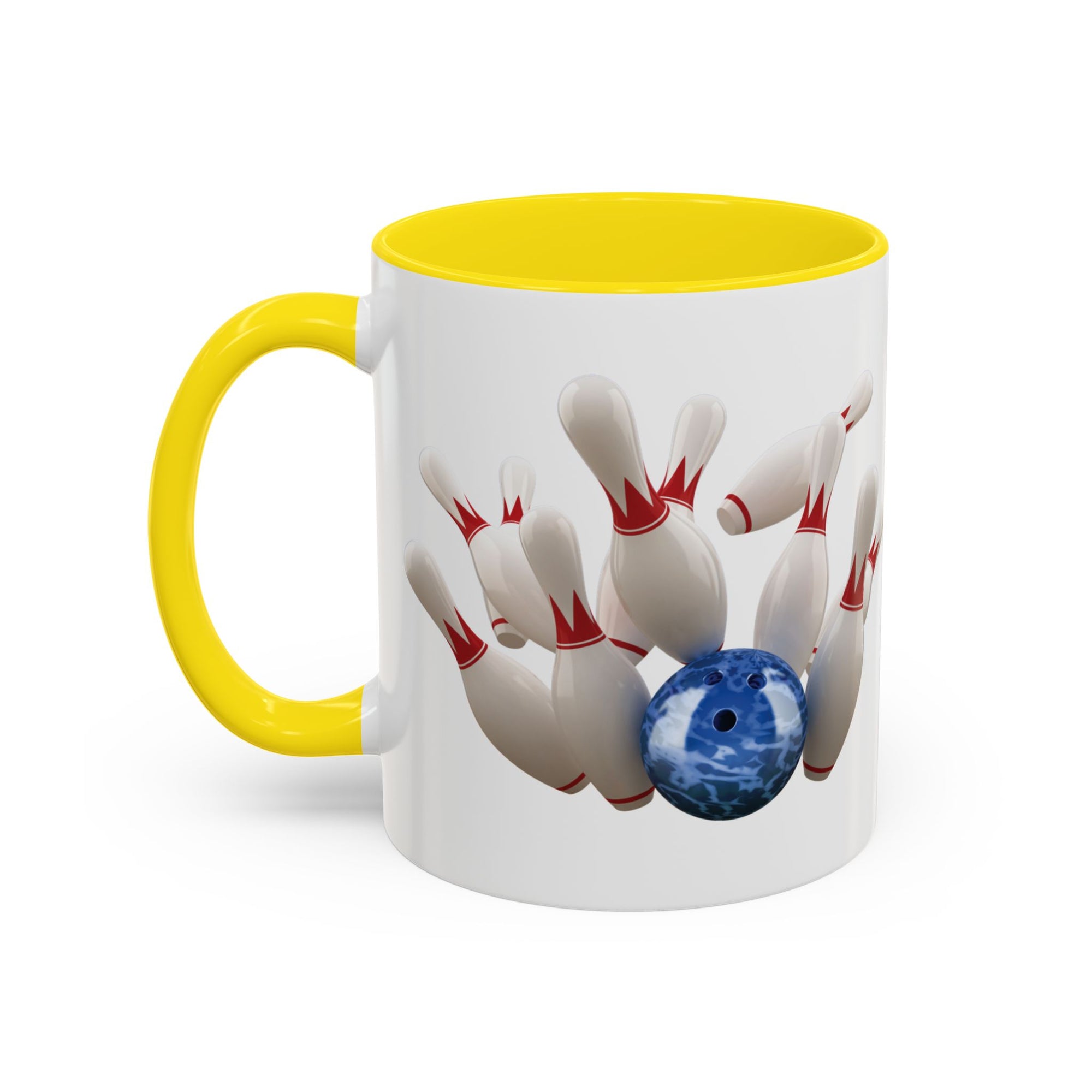 A white ceramic coffee mug with yellow accents on the handle and interior, with a graphic of a blue bowling ball knocking over bowling pins, on a white background