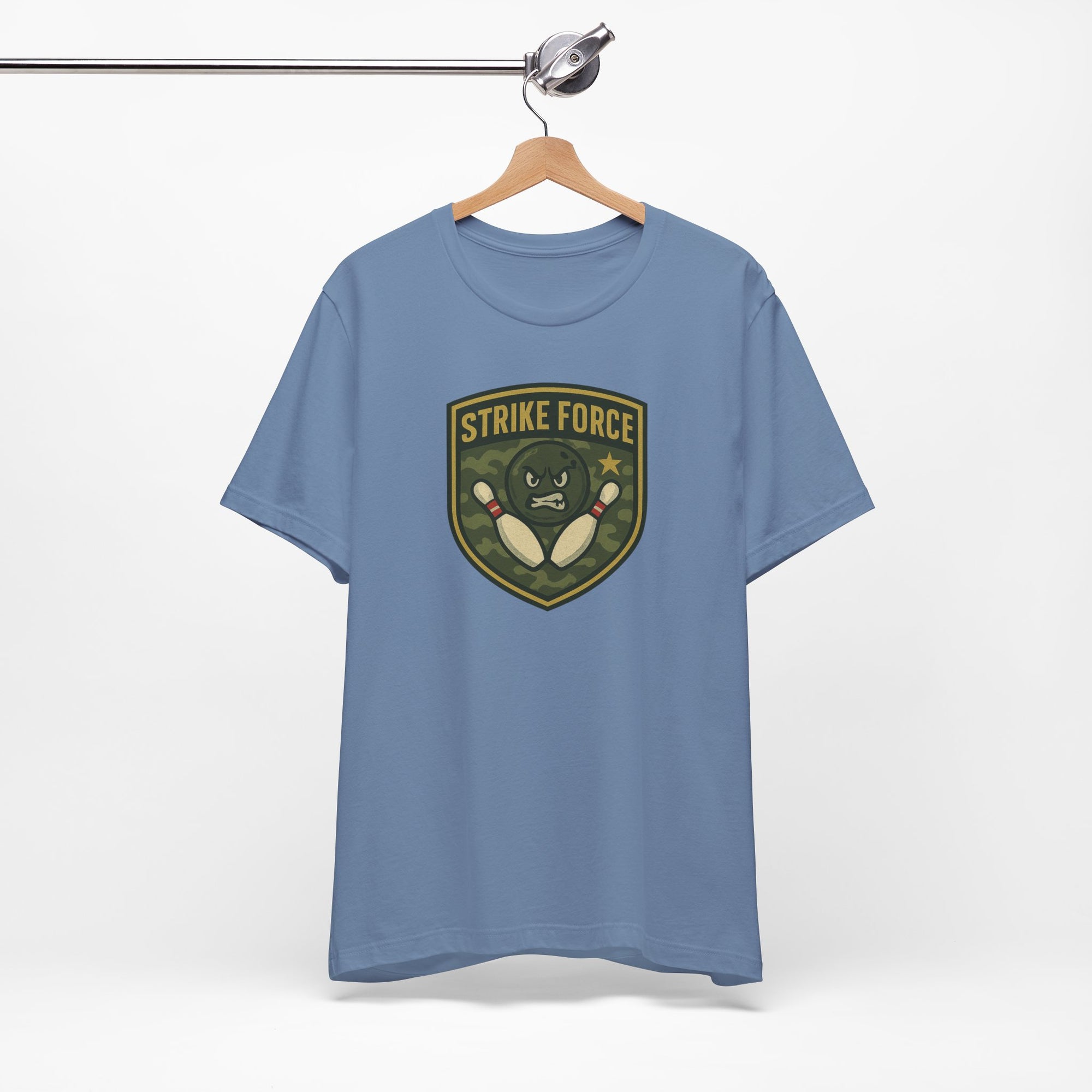 Steel blue t-shirt with bowling 'Strike Force' military-style patch on a hanger against a white background